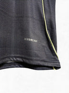 Close-up of a black athletic shirt with 'Aeroready' text on a white background