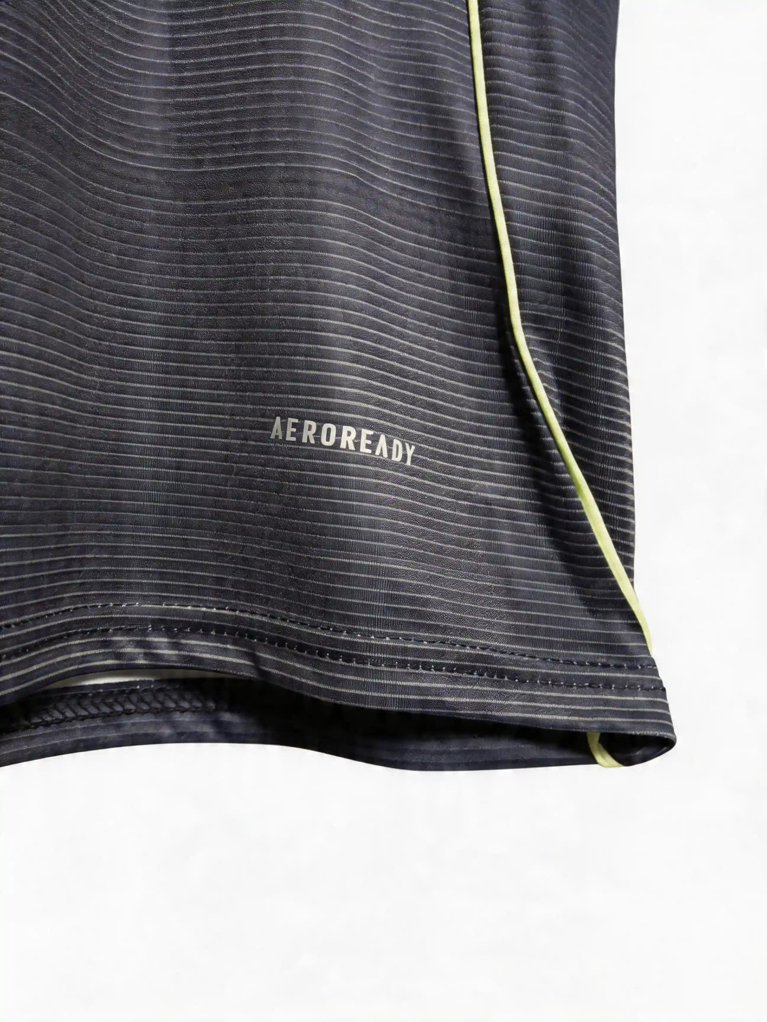 Close-up of a black athletic shirt with 'Aeroready' text on a white background