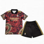 Real Madrid soccer jersey and shorts set with dragon design on a white background